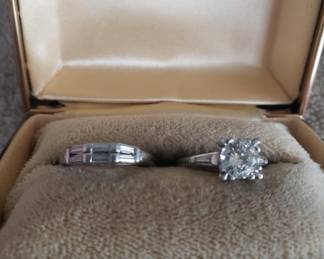 Platinum engagement, diamond solitaire, ring, along with baguette wedding band.  Very, very pretty