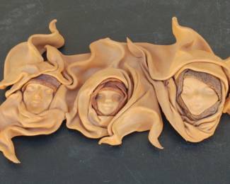 Molded Leather Faces Signed By Artist