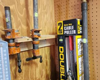 Double cable puller, clamps