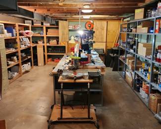 Basement has old car parts, nails, screw, spray paint ect..