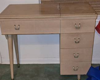 This is a Sewing Cabinet with no machine in it. Make a cute desk or Vanity 
