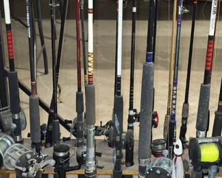 We have 36 Fishing Poles with Reels - Nice Pole Rack