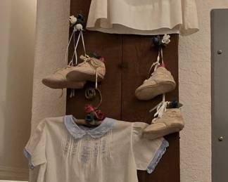 Vintage Wooden Ironing Board with Baby Clothes Used as  Washroom Decor