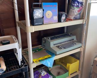 Plastic shelving, Vtg. Typewriter, lighting