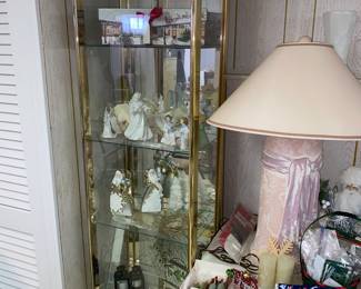 1 of 2 glass and brass metal display cabinets