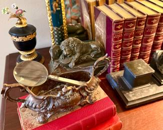 Matching bronze bookends and antique leather bound books