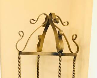 Gilt metal etagere with glass shelves - 16” diameter, 72” tall