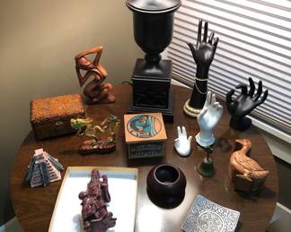 Assorted knick knacks: Chinese carved hardstone figurine, stone pyramid, metal dragon, hands