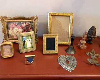 Assorted framed + cast iron tchotchkes
