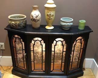 Black wooden cabinet with interior light (43”L, 11.5”D, 30”H) + assorted pottery