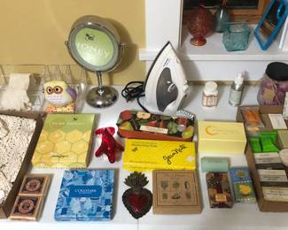 Doilies, assorted soaps (some L'Occitane), makeup mirror, iron