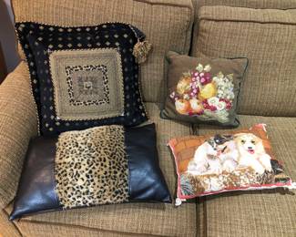 Throw pillows including needlepoint