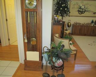 Tall case clock - metal crane statues