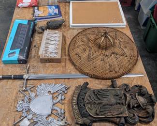 Medieval decorative coat of arms & sword $40, European decorative coat of arms & sword $40, Asian hat $10, bird spikes $5, wireless keyboard and mouse $15, two cork bulletin boards $5 each