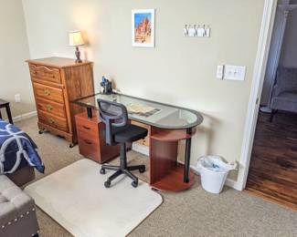 chest of drawers to Queen bedroom set (mattress, box springs, frame, headboard, dresser w mirror, chest of drawers, night stand $550), button tufted fabric storage bench with rivets ($50), brown end table ($20), modern glass desk with side drawers & shelves ($100), custom plywood chair mat for carpet ($50), office chair on wheels ($25), short lamp ($8)