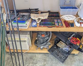 painting easel ($10), small art set of markers & oil pastels & crayons ($15), large art set in wood case of color pencils & markers & watercolor paints ($25), large drawing pads of paper ($5 each), graphite set of pencils ($5), red set of medium & small paint brushes ($15), blue set of small paint brushes ($10), 4 tubes of oil paint ($5 each), plastic artist palette & palette tools ,
($10). Bottom: Frigidaire window air conditioning AC unit ($125), shop vacuum ($20), Homelite 18" 45cc chainsaw w case ($80, needs chain), 
