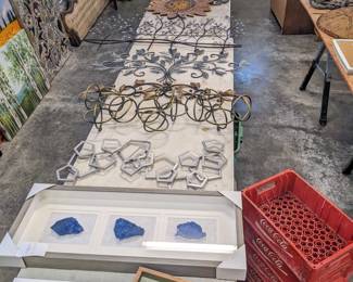 Small decor $5 each, Coca-Cola plastic crates $5 each, blue gemstone shadow box decor $40, metal wall decor $15-$30