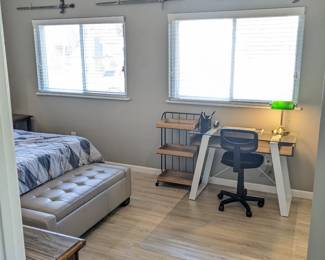 Available Mar 1: modern glass & metal desk ($100), new office chair with wheels ($25), chair mat ($20), 3 decorative coat of arms w swords ($40/set), tufted vinyl storage bench ($50)