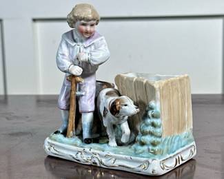 PORCELAIN SPILL VASE | Boy with dog glazed porcelain spill vase with gilt accent, with impressed stamp marks on the bottom - h. 4.5 x w. 2.25 x l. 4 in