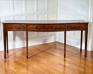 FEDERAL STYLE SIDEBOARD BUFFET | 20th century, of serpentine shape, having three frieze drawers over square tapering legs terminating in spade feet, with overall contrasting inlay. - h. 33.5 x w. 78 x l. 24 in