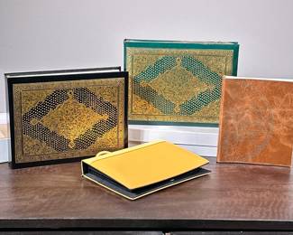 (4pc) [NIB] TOOLED LEATHER PHOTO ALBUM & SCRAPBOOKS | Including two guilt to old leather scrapbooks from the Metropolitan Museum of Art circa 1998. The cover design is adapted from a 16th century French leather binding tool and gold and black from the cloister apocalypse. A rare illuminated manuscript made about 1300 in Normandy, France manufactured in Florence Italy. - h. 9 x w. 6 in (largest)
