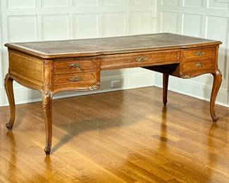 VINTAGE CARVED OAK EXECUTIVE’S DESK | With five drawers to one side, and with faux drawers on the front, inset leather top over carved cabriole legs. - h. 30 x w. 70 x d. 32 in
