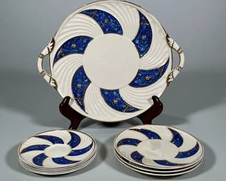 (9pc) Belleek Porcelain Dishes | Cobalt blue swirled pattern with gilt rims and highlights, including a double-handled dish, three small plates, and five saucers, with black Belleek marks to undersides - w. 11 in (largest)
