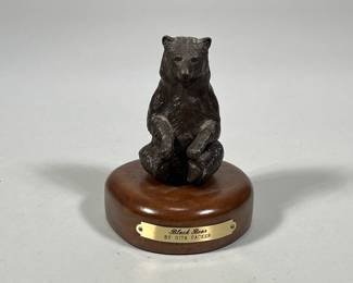 GITA PACKER BRONZE BLACK BEAR | “Black Bear” bronze statue by Gita Packer on wood base with brass plaque. - h. 4.5 x dia. 3.75 in

