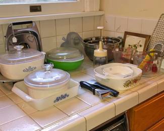 Lots of mid-century cookware, including copper pots and Corningware