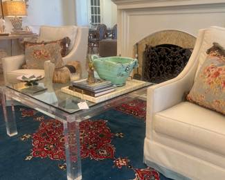 40” acrylic and glass coffee table, oriental 8.5’ x 12.5’ rug, pair of swivel chairs