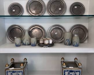 Floral cache pot with gold finials, pewter plates