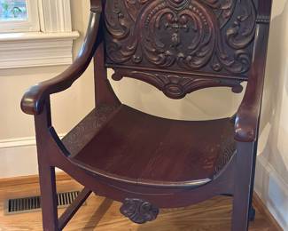 Carved wood open arm chair