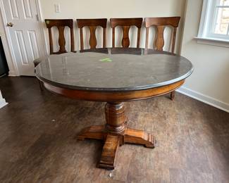 Marble top round table. Height is adjustable and can be parlor table