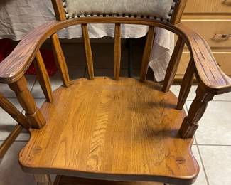 One of the four Ranch Oak arm chairs from the dining table set