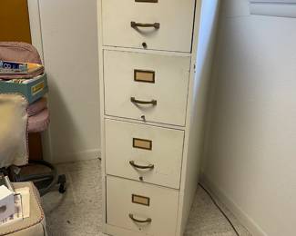 Vintage military wood (WWII?) painted filing cabinet, can be found in the garage
