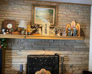 The fireplace and mantel in the Den. Beautiful Nativity, hand painted screen, handmade Ranch Oak clock, decoys