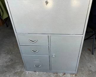 Metal locking filing cabinet with fold down desk.