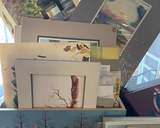 Larger pieces of Dale's art work with out frames and a trunk painted by Doris