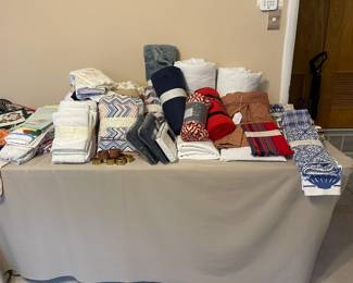 Lots of bed linens, throws, pillow cases