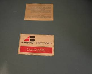 The label of the blue arm chairs, made by Brandt of Fort Worth, the company that make the Ranch Oak Furniture
