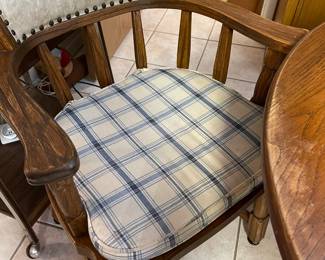 A look at one of the chairs with back support and seat cushion