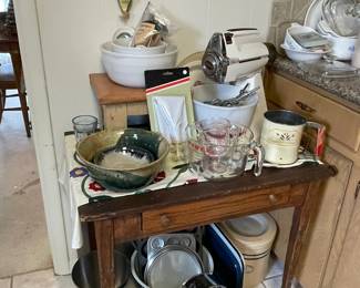 Great old table with mixer, mixer bowls, Pyrex, ceramics and lots of baking tins