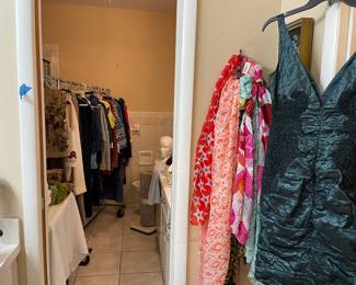 Looking into the Master bathroom, the second rack of clothing can be found there