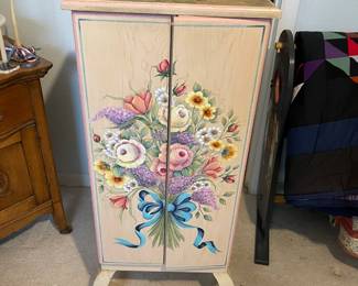 This is beautiful, hand painted jewelry chest with lots of storage