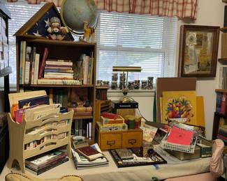 In Office/Sewing Room, lots of great books, art work, vintage oak filing drawers, desk lamp and lots of buttons