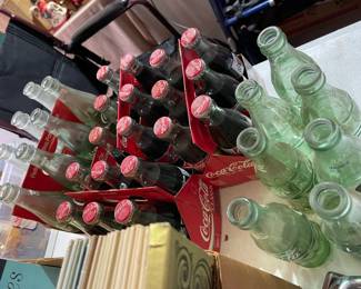 Coca Cola bottles in case and without 
