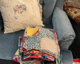 Blue arm chair, cushions, and quilt blocks