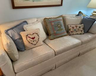 This vintage sofa can be found in the living room by the register area, lots of great cushion