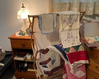Guest room, vintage clothes hanger, vintage lines and quilt pieces, vintage bedside table