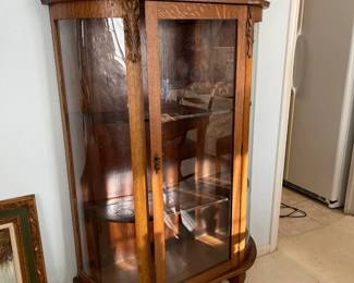 The antique oak china cabinet